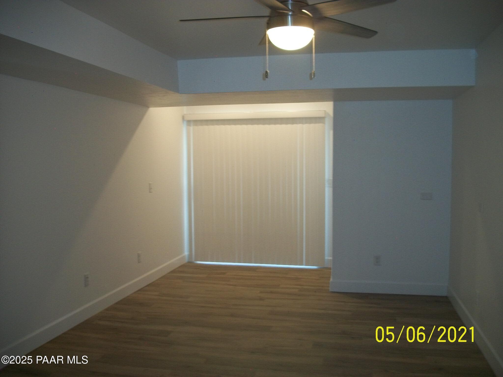 5270 Diamond Drive, Unit B Prescott, AZ 86301 - Photo 6 of 12 a view of an empty room with wooden floor