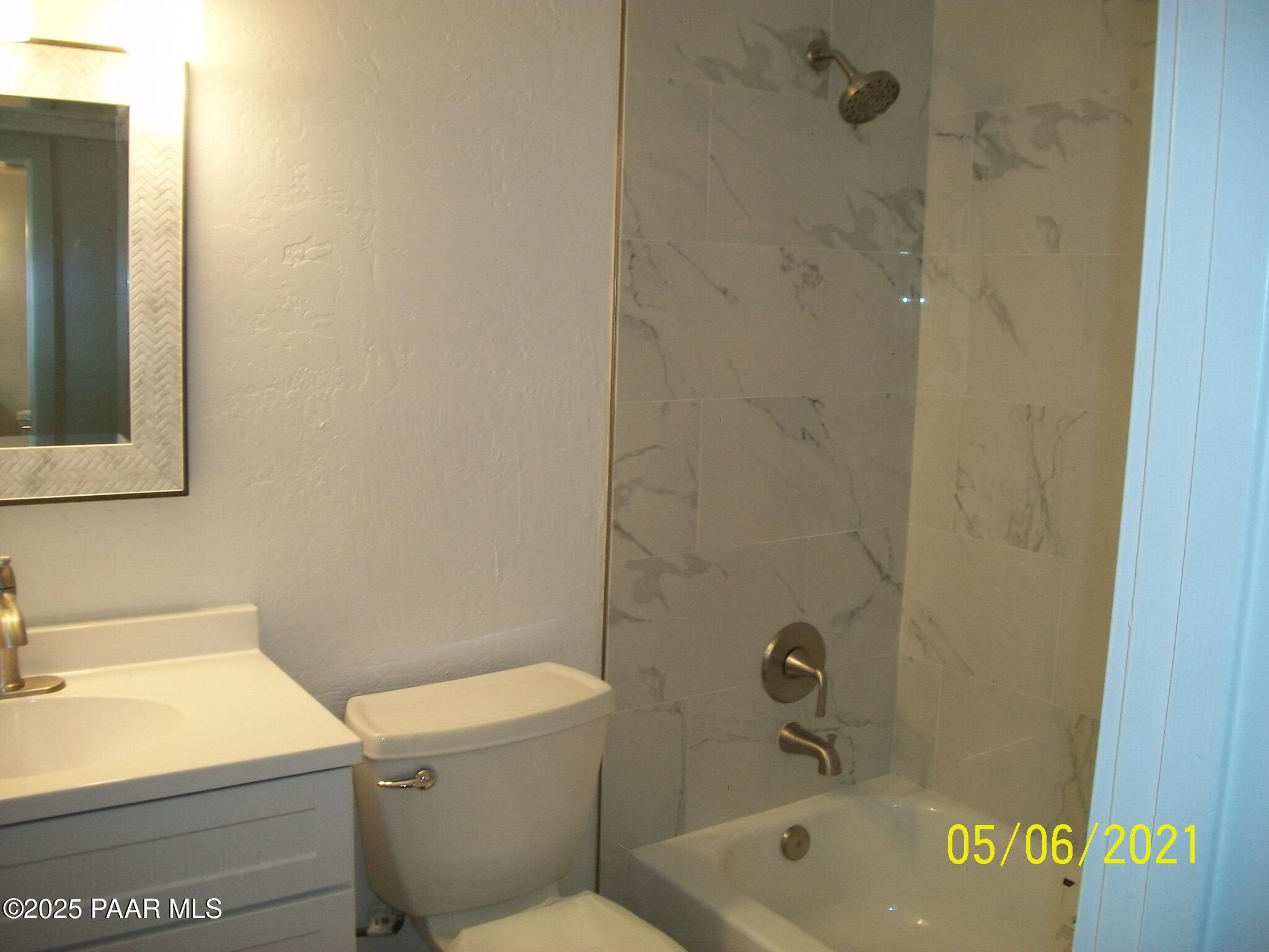5270 Diamond Drive, Unit B Prescott, AZ 86301 - Photo 7 of 12 a bathroom with a sink a toilet and shower