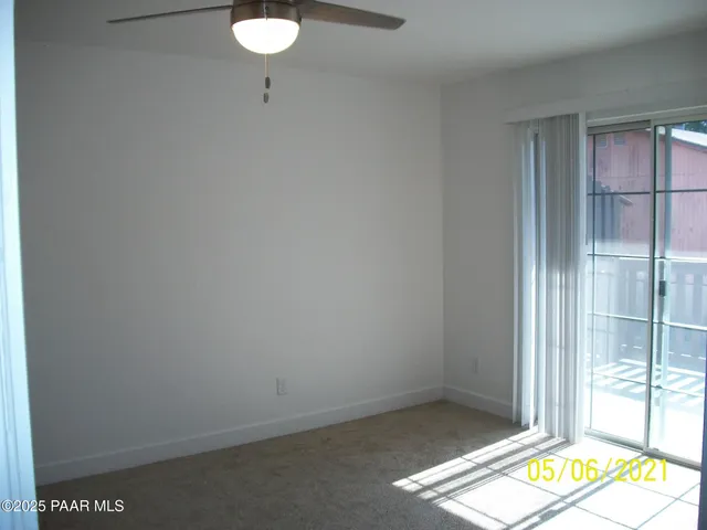 a view of an empty room and a window
