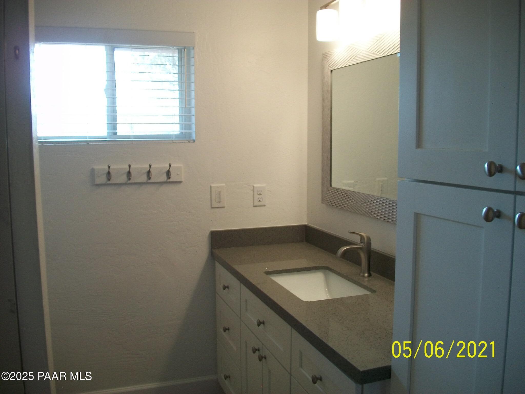 5270 Diamond Drive, Unit B Prescott, AZ 86301 - Photo 10 of 12 a bathroom with a granite countertop sink and a vanity