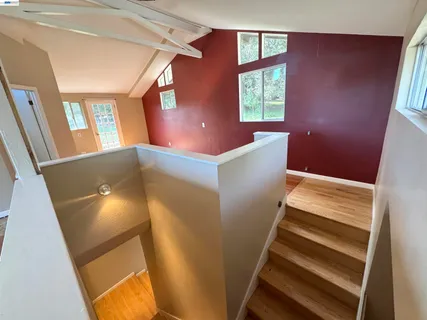 a view of an entryway with wooden floor