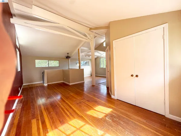 a view of a living room with a wooden floor