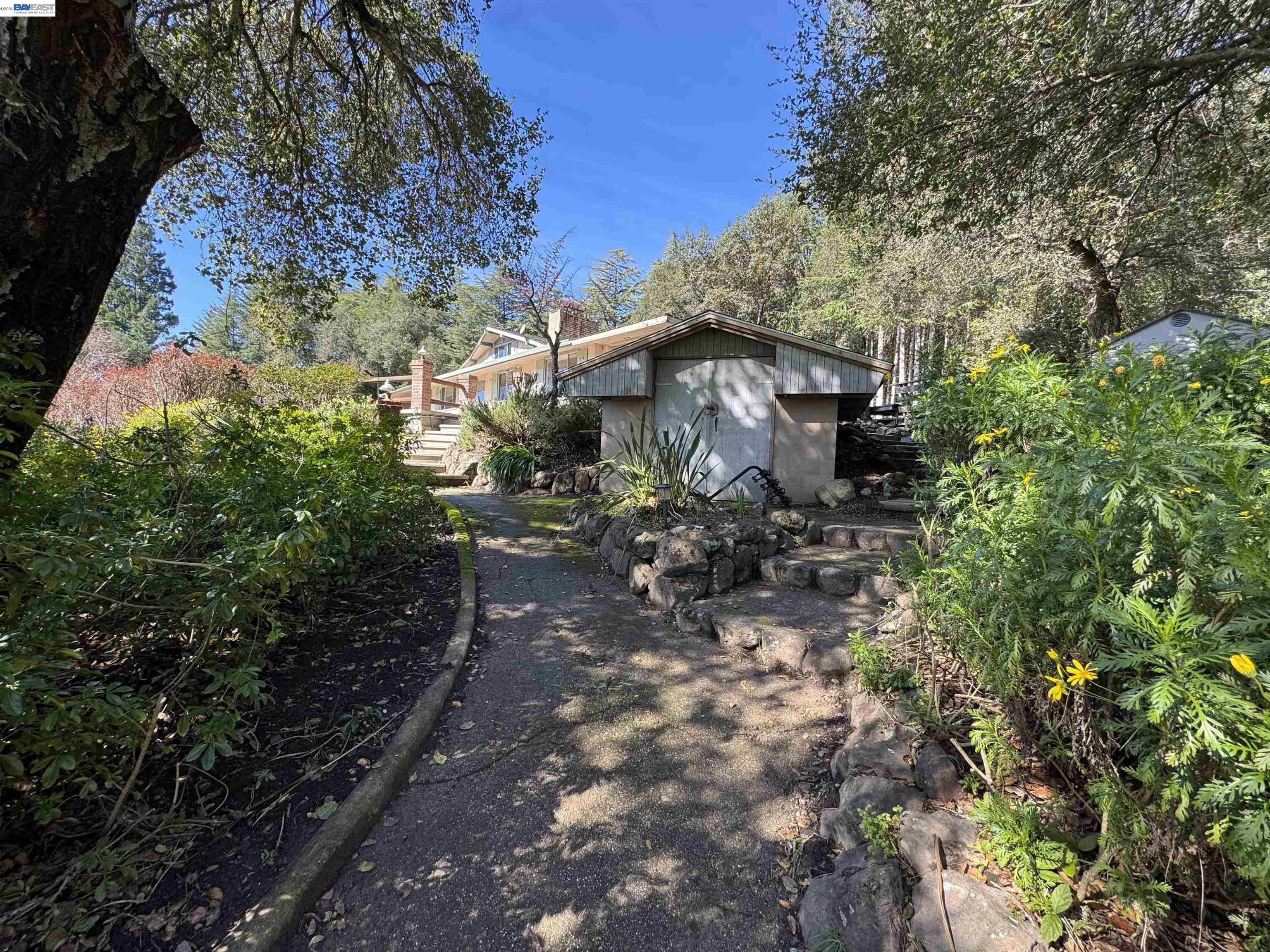 17121 Laurel Road Los Gatos, CA 95033 - Photo 31 of 43 a view of a house with a yard
