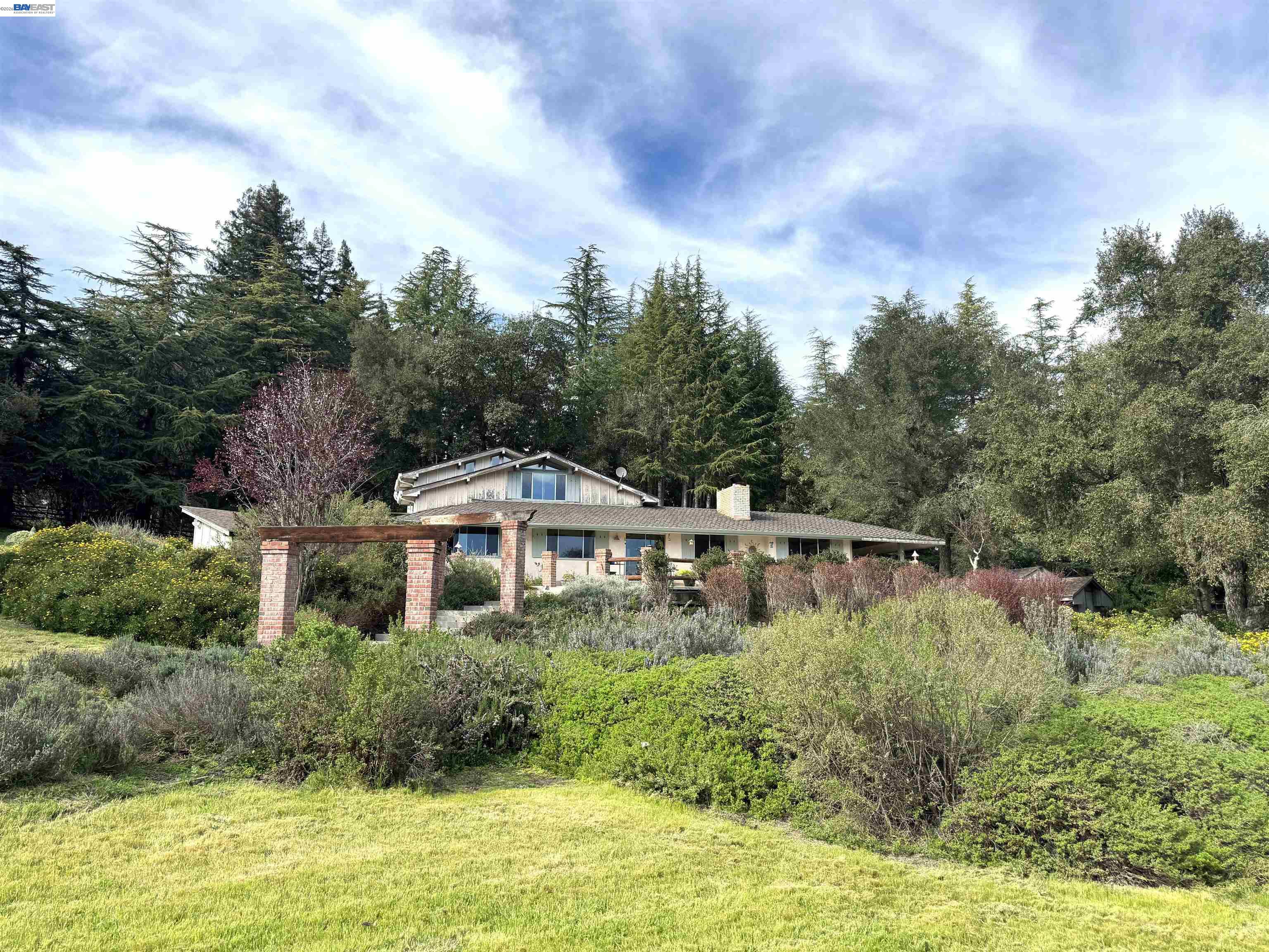 17121 Laurel Road Los Gatos, CA 95033 - Photo 35 of 43 a house with swimming pool in front of it