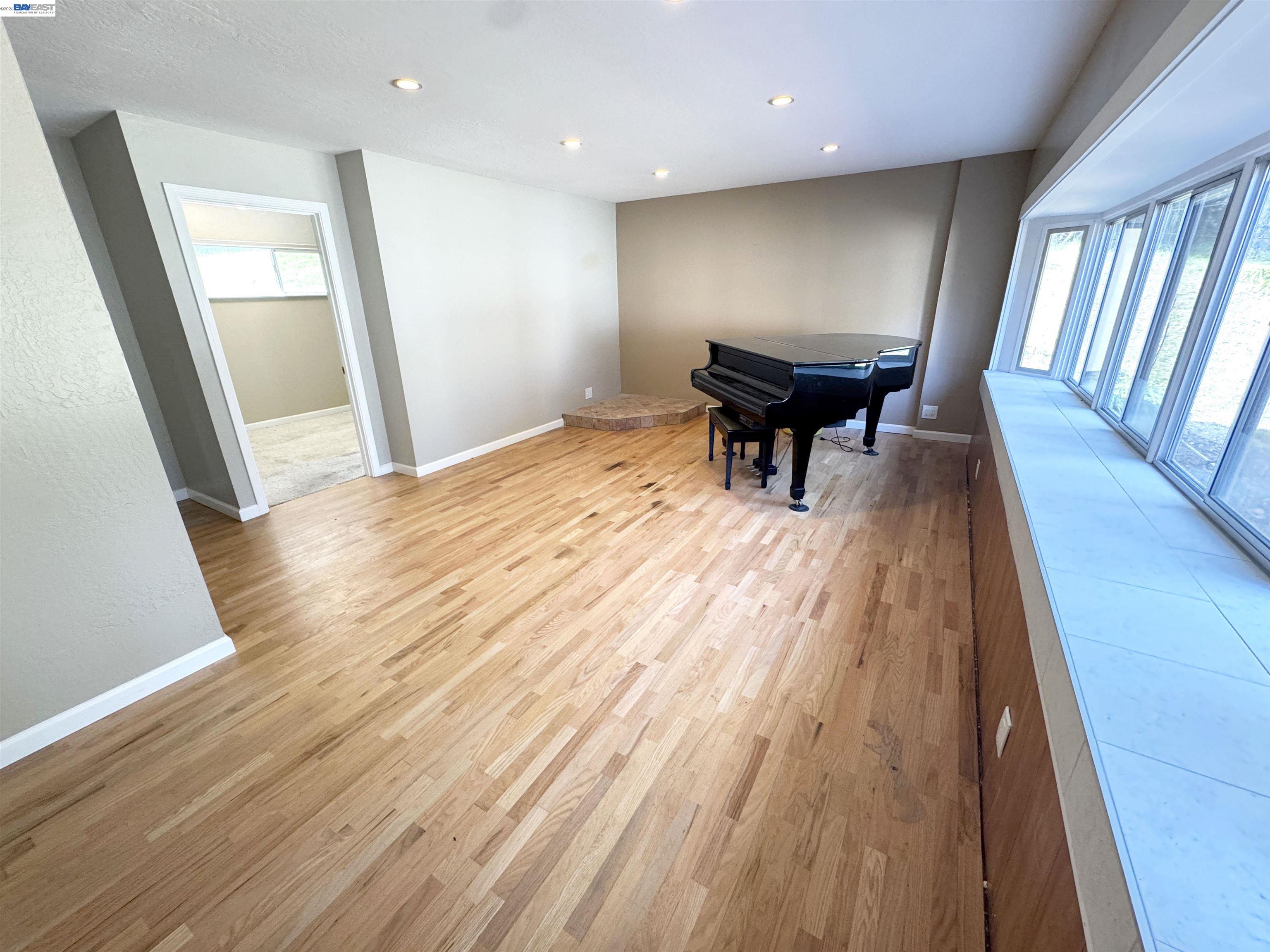 17121 Laurel Road Los Gatos, CA 95033 - Photo 10 of 43 a view of a room with wooden floor and staircase