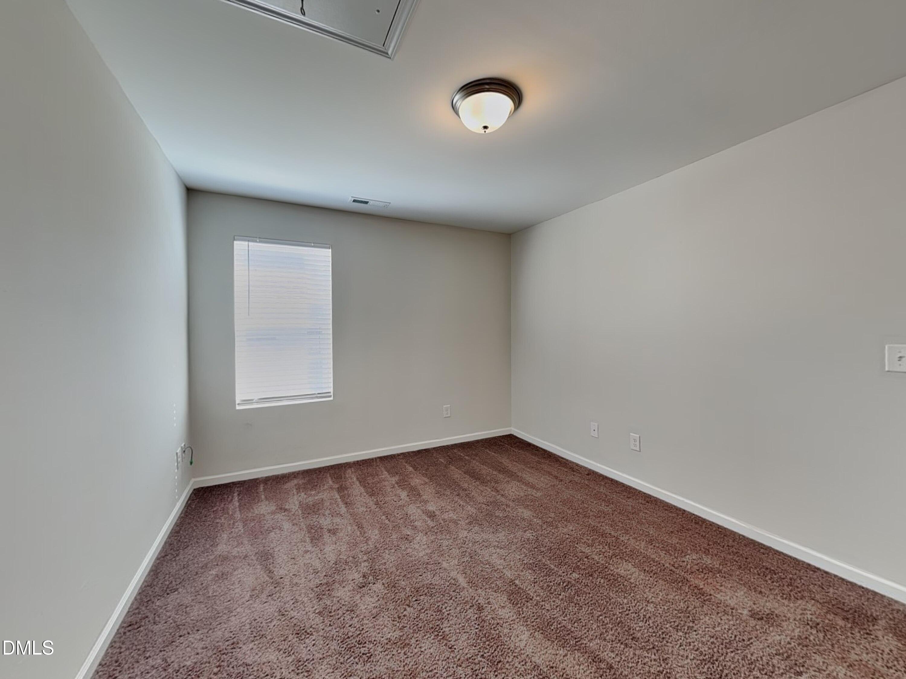 198 Outwater Ridge Drive Garner, NC 27529 - Photo 17 of 22 an empty room with a window