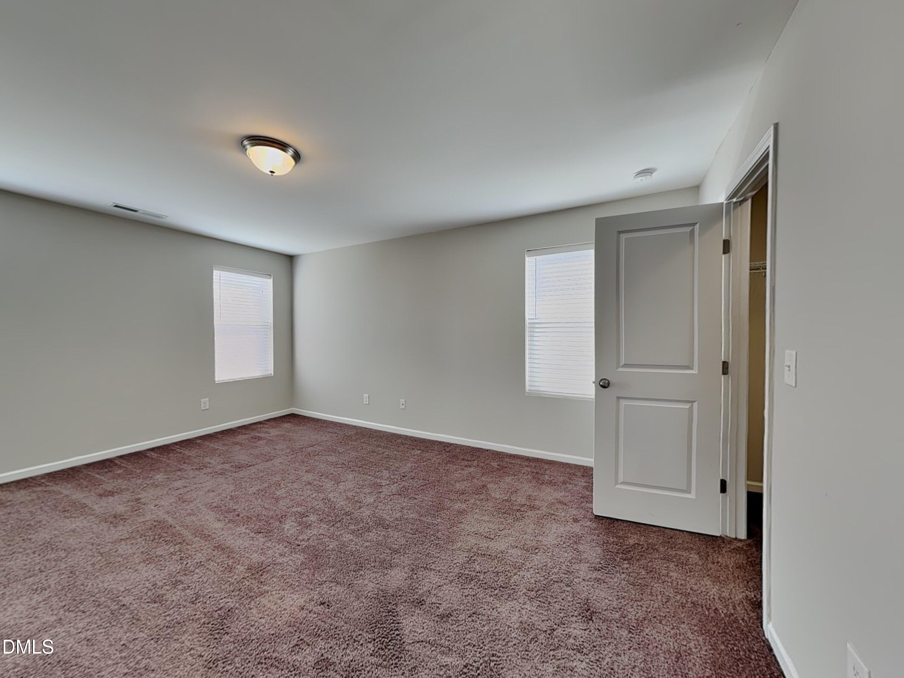 198 Outwater Ridge Drive Garner, NC 27529 - Photo 18 of 22 a view of an empty room and window