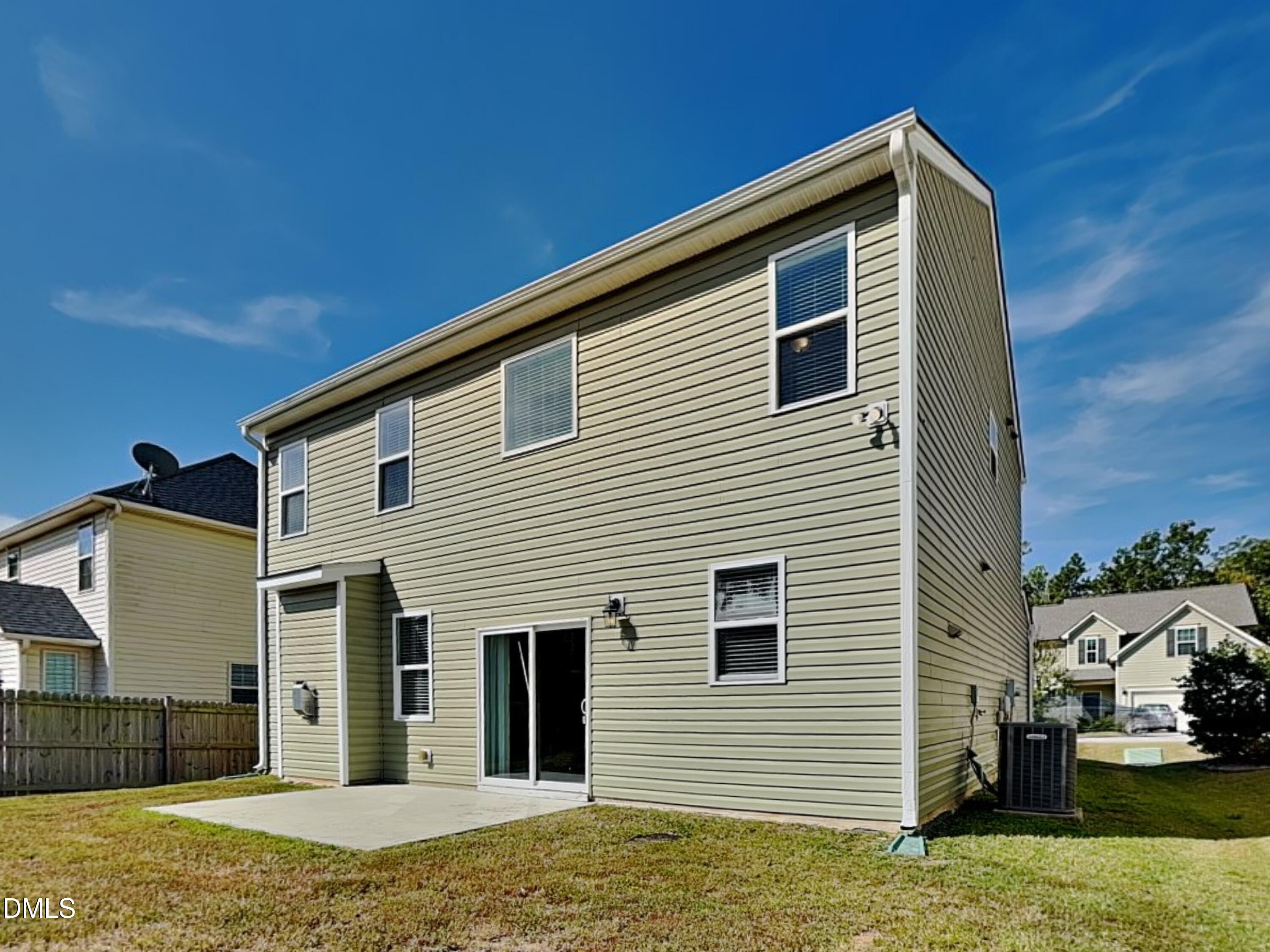 198 Outwater Ridge Drive Garner, NC 27529 - Photo 19 of 22 a view of a house with a yard