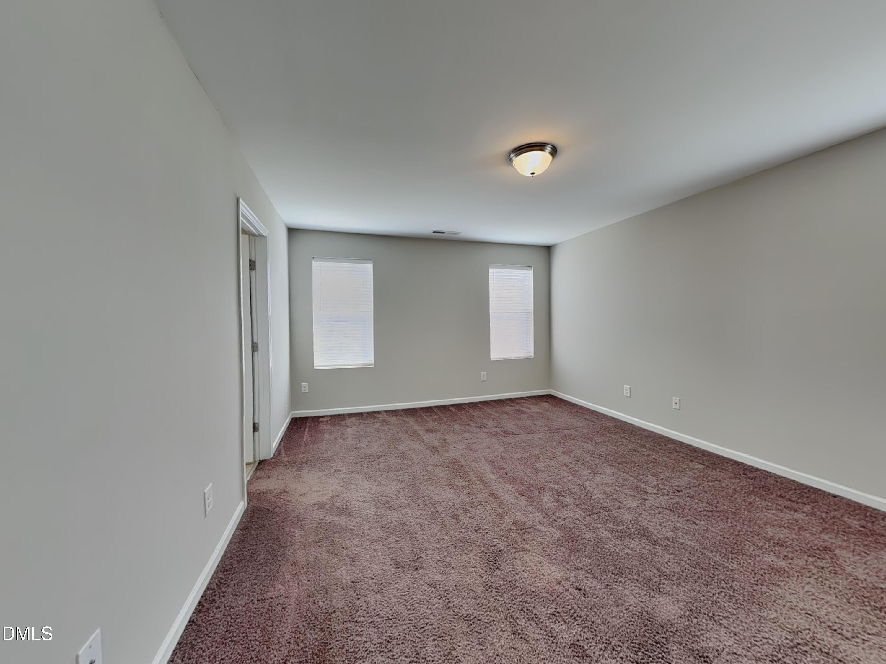 198 Outwater Ridge Drive Garner, NC 27529 - Photo 8 of 22 an empty room with windows