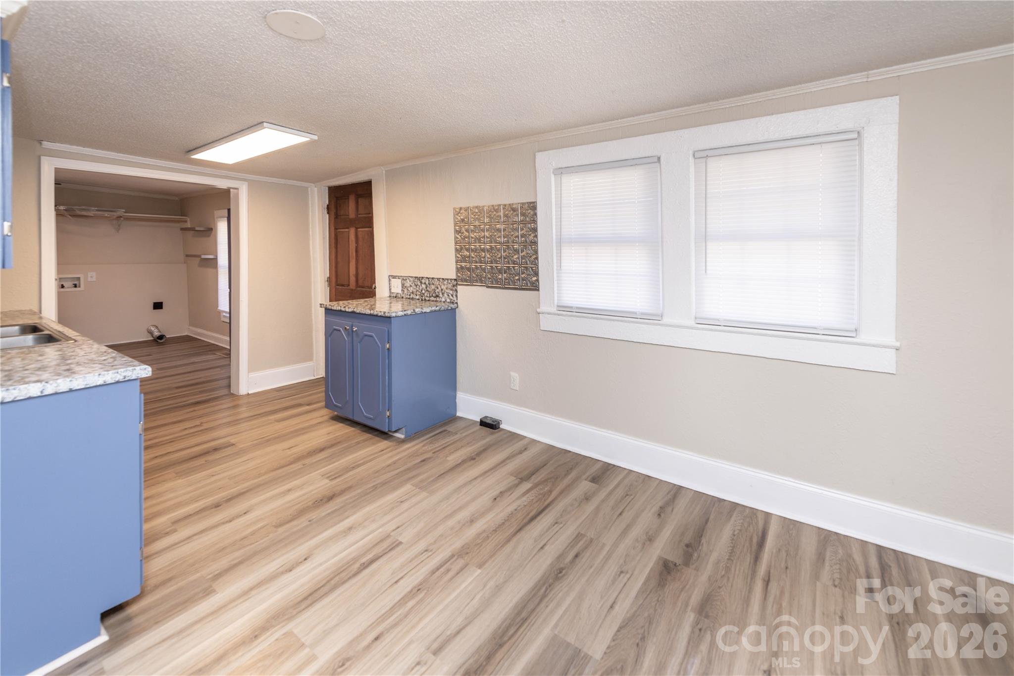 470 South Moose Road Mount Pleasant, NC 28124 - Photo 14 of 37 an empty room with wooden floor and windows