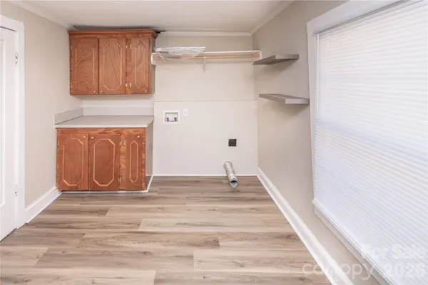 a view of an entryway with wooden floor