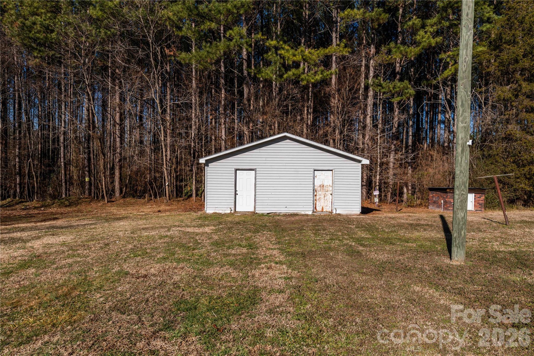 470 South Moose Road Mount Pleasant, NC 28124 - Photo 35 of 37 a house with trees in front of it