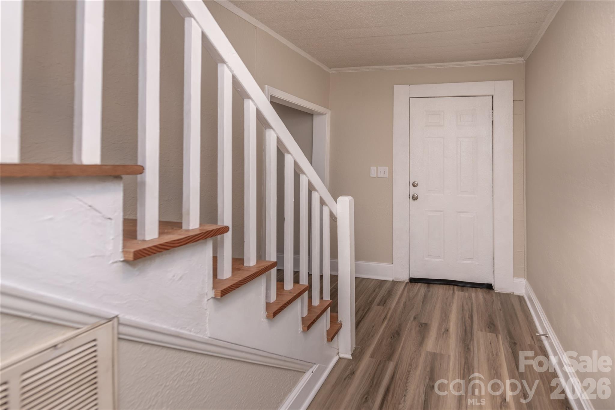 470 South Moose Road Mount Pleasant, NC 28124 - Photo 7 of 37 a view of a hallway with wooden floor and staircase