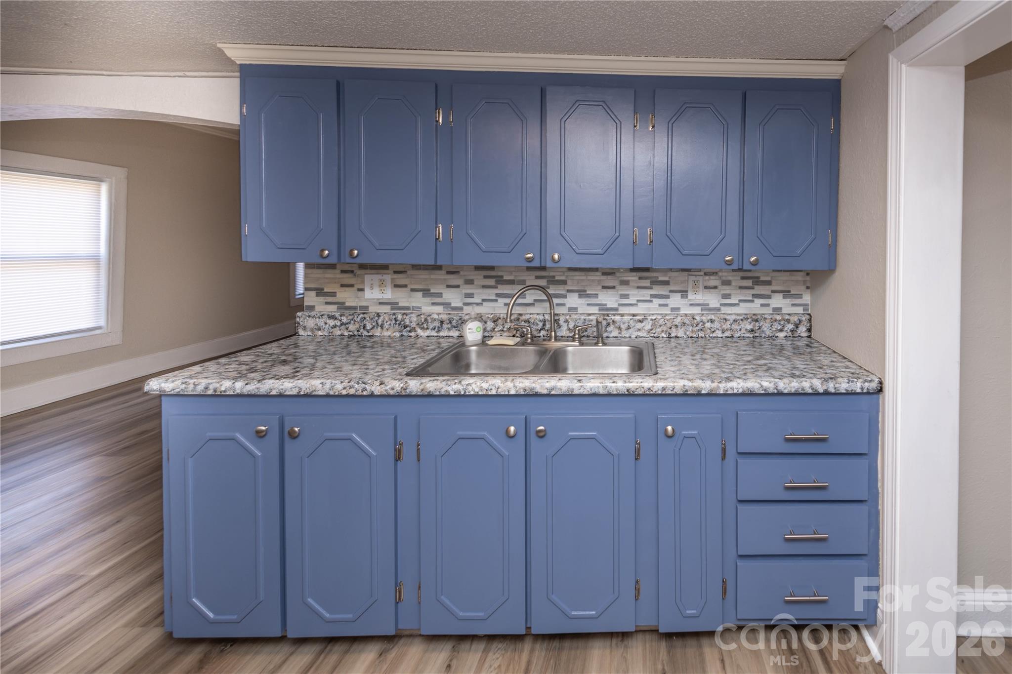 470 South Moose Road Mount Pleasant, NC 28124 - Photo 10 of 37 a kitchen with granite countertop wooden cabinets a sink and dishwasher