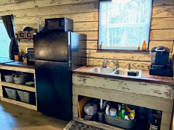 a kitchen with a stove and a refrigerator