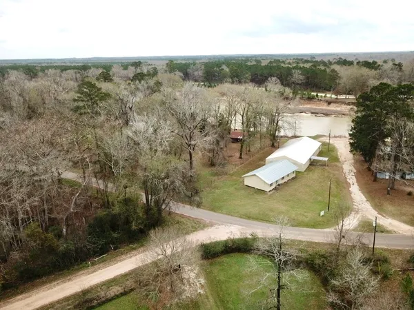 a view of a yard with large trees