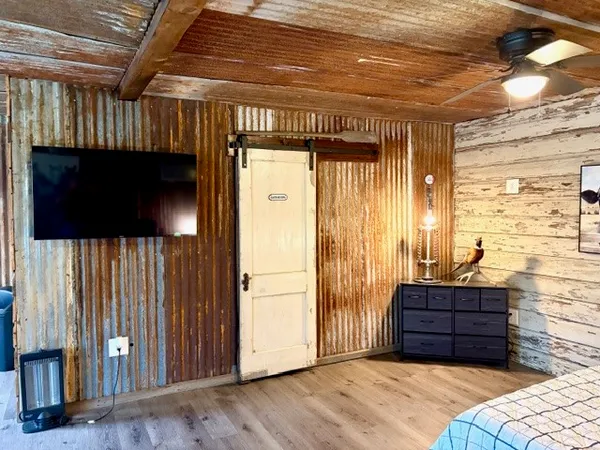 a living room with a couch and a flat screen tv