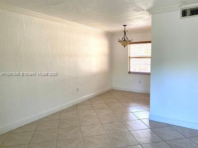 8601 Southwest 94th Street, Unit 227W Miami, FL 33156 - Photo 11 of 17 a view of an empty room with a window
