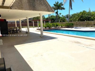8601 Southwest 94th Street, Unit 227W Miami, FL 33156 - Photo 16 of 17 a view of a swimming pool with a patio