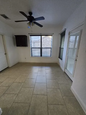 a view of an empty room with a window