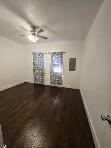 a view of an empty room and a window