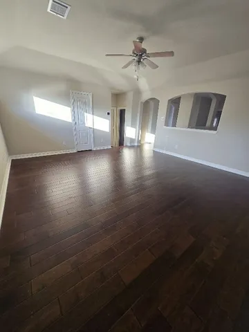 a view of livingroom and hardwood floor