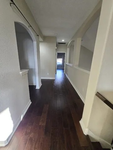 a view of gallery with wooden floor