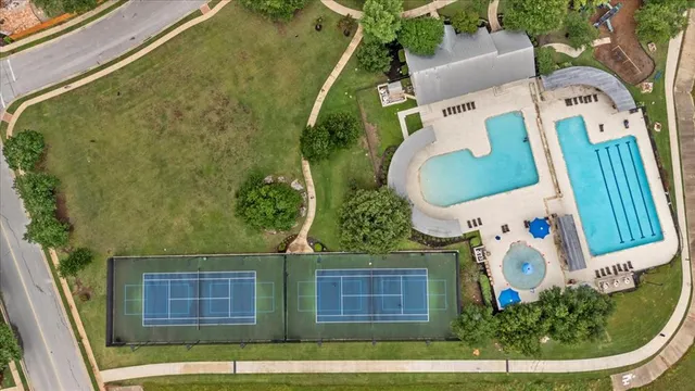 an aerial view of a house with a swimming pool