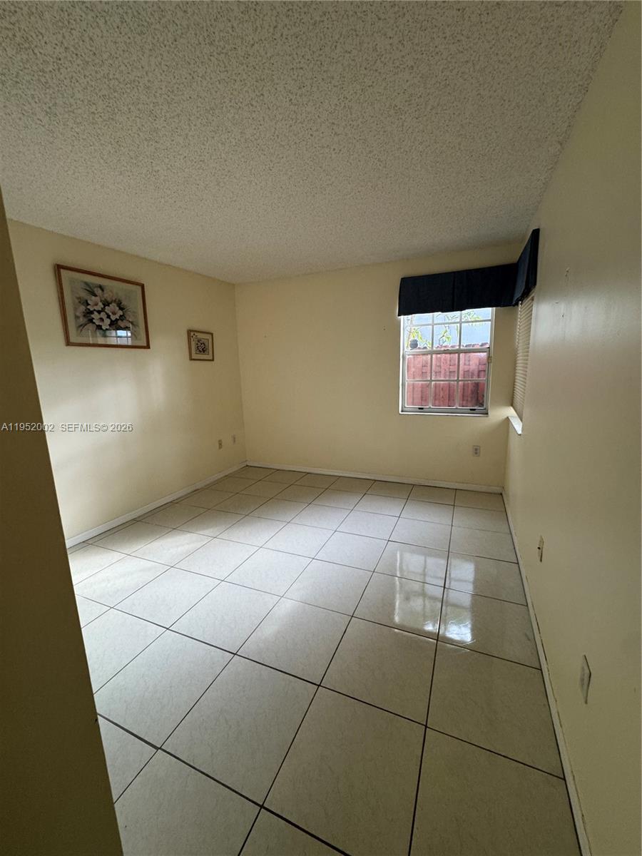 14241 Southwest 36th Street Miami, FL 33175 - Photo 11 of 18 a view of an empty room with a window