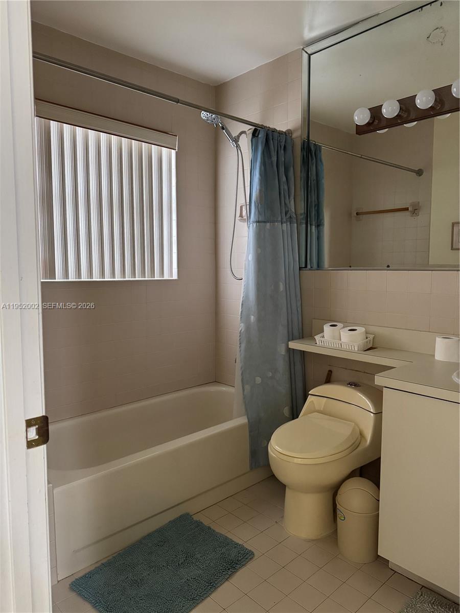 14241 Southwest 36th Street Miami, FL 33175 - Photo 13 of 18 a bathroom with a sink a toilet and shower