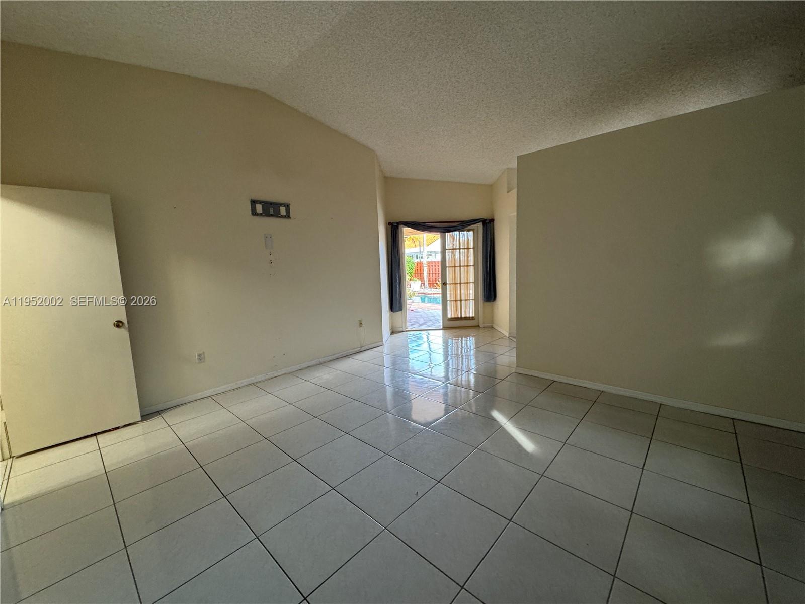 14241 Southwest 36th Street Miami, FL 33175 - Photo 10 of 18 a view of an empty room and window
