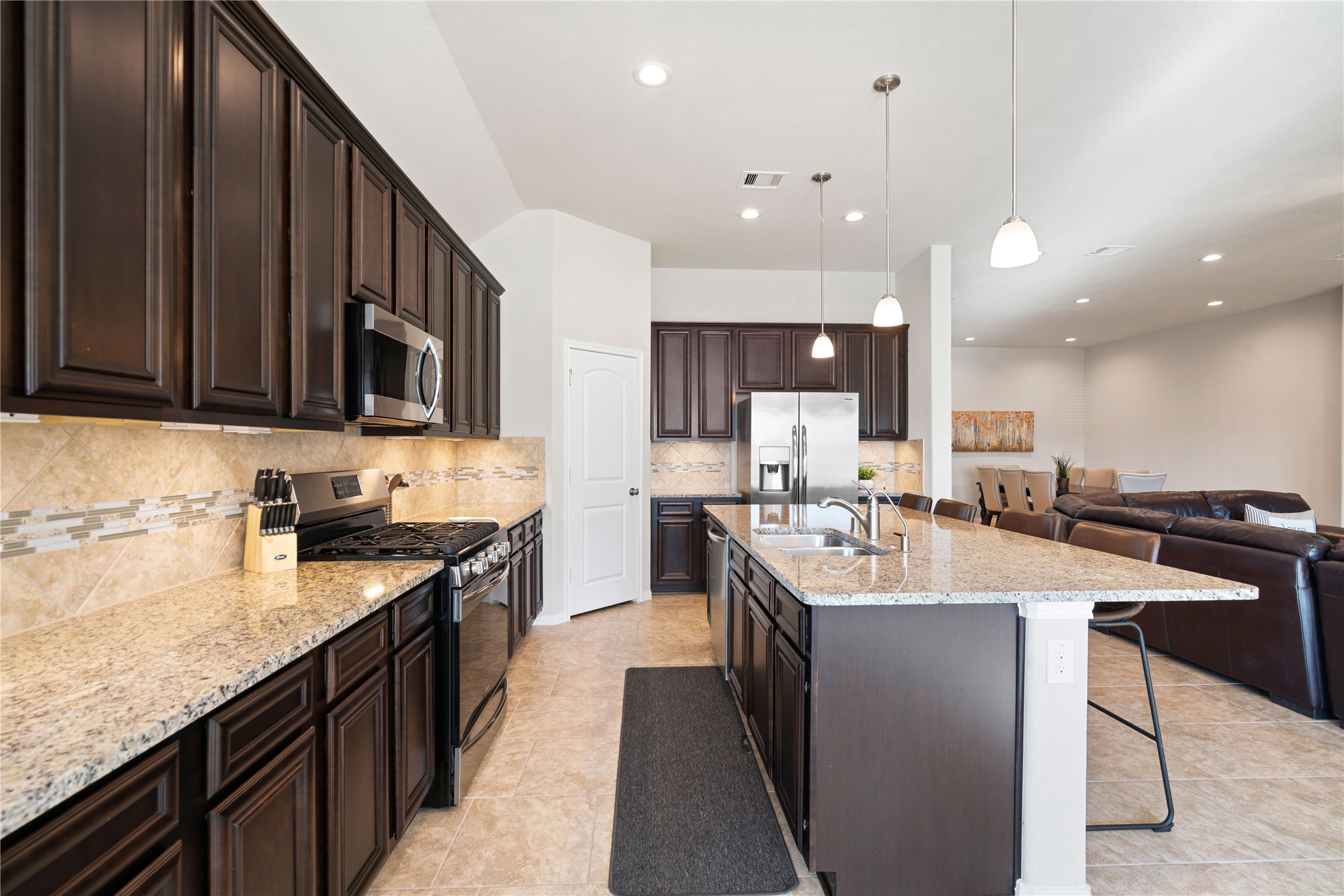 14300 Congaree Court Conroe, TX 77384 - Photo 12 of 31 a large kitchen with lots of counter space a sink and appliances