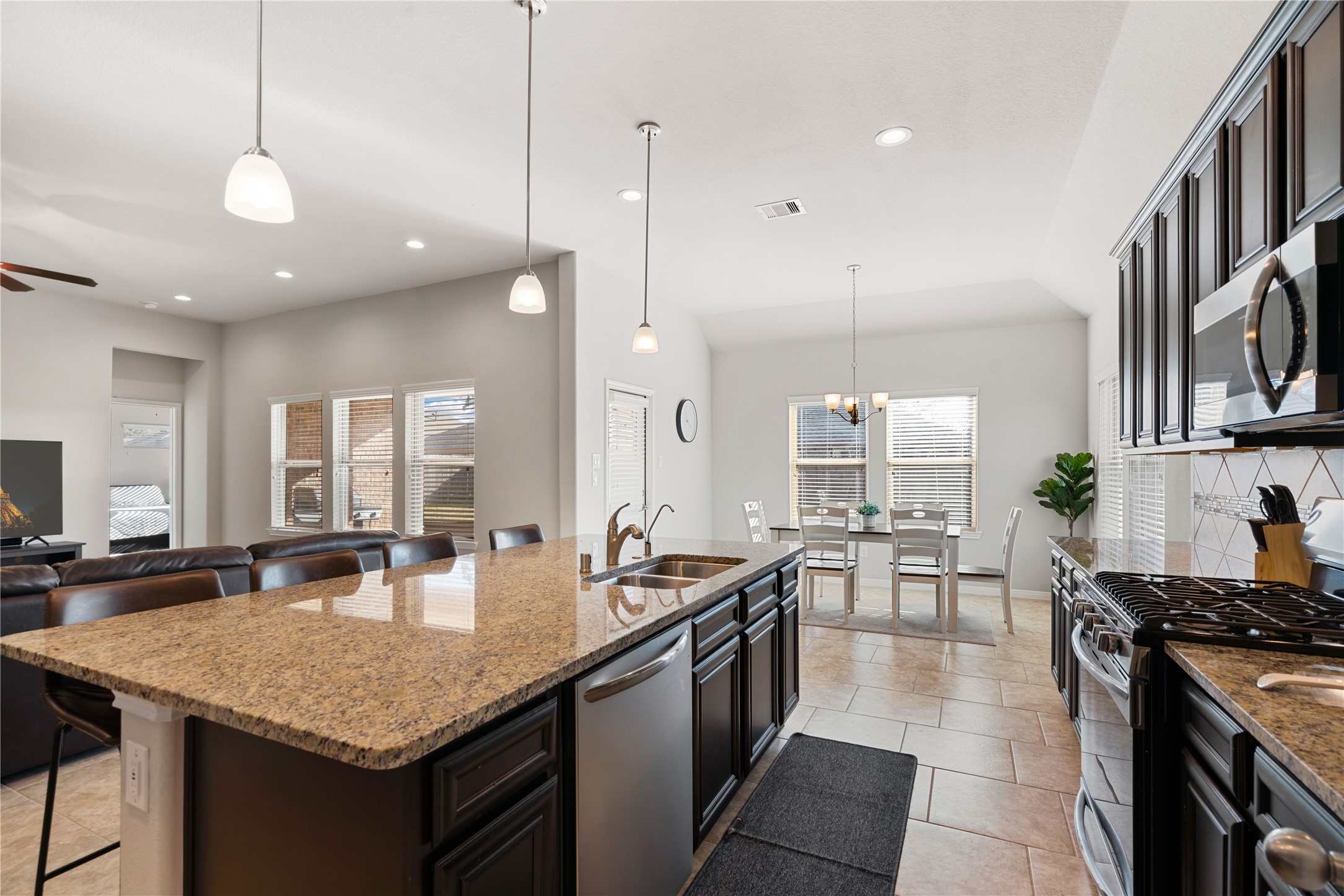 14300 Congaree Court Conroe, TX 77384 - Photo 14 of 31 a kitchen with granite countertop lots of counter top space