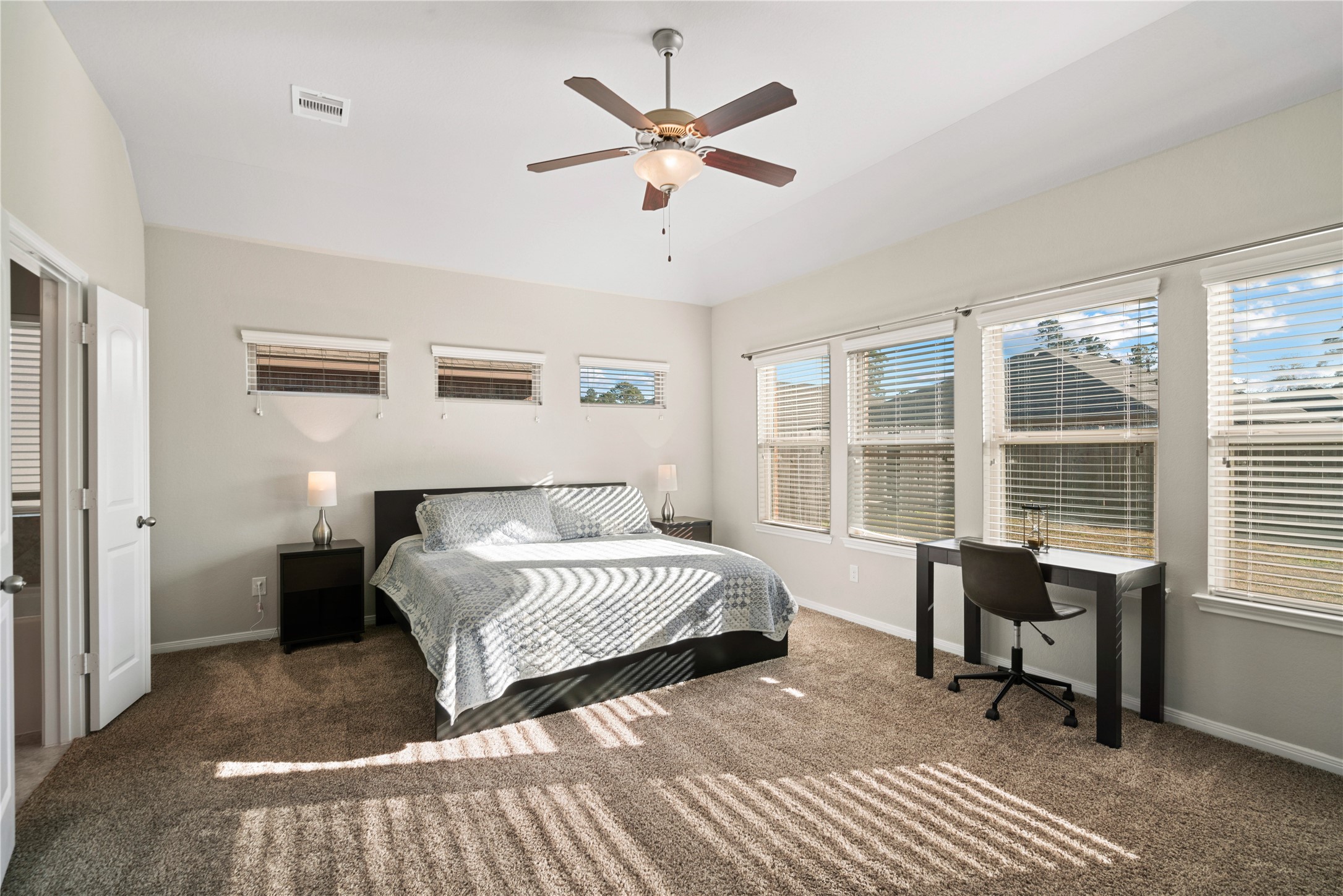 14300 Congaree Court Conroe, TX 77384 - Photo 16 of 31 a bedroom with a bed and a large window