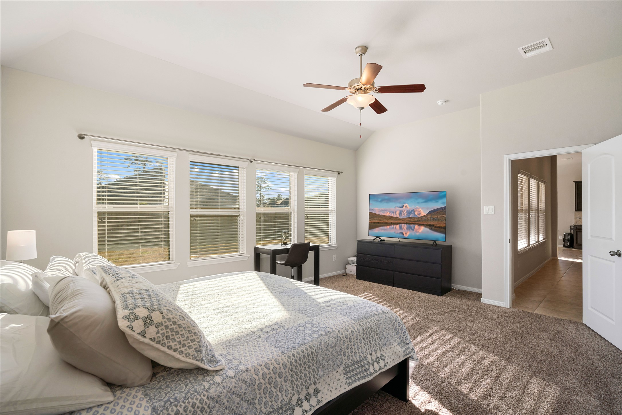 14300 Congaree Court Conroe, TX 77384 - Photo 17 of 31 a bedroom with a bed and a large window