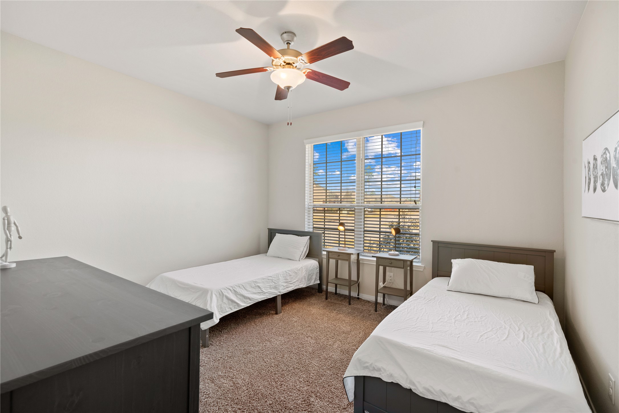 14300 Congaree Court Conroe, TX 77384 - Photo 23 of 31 a bedroom with a bed and a desk