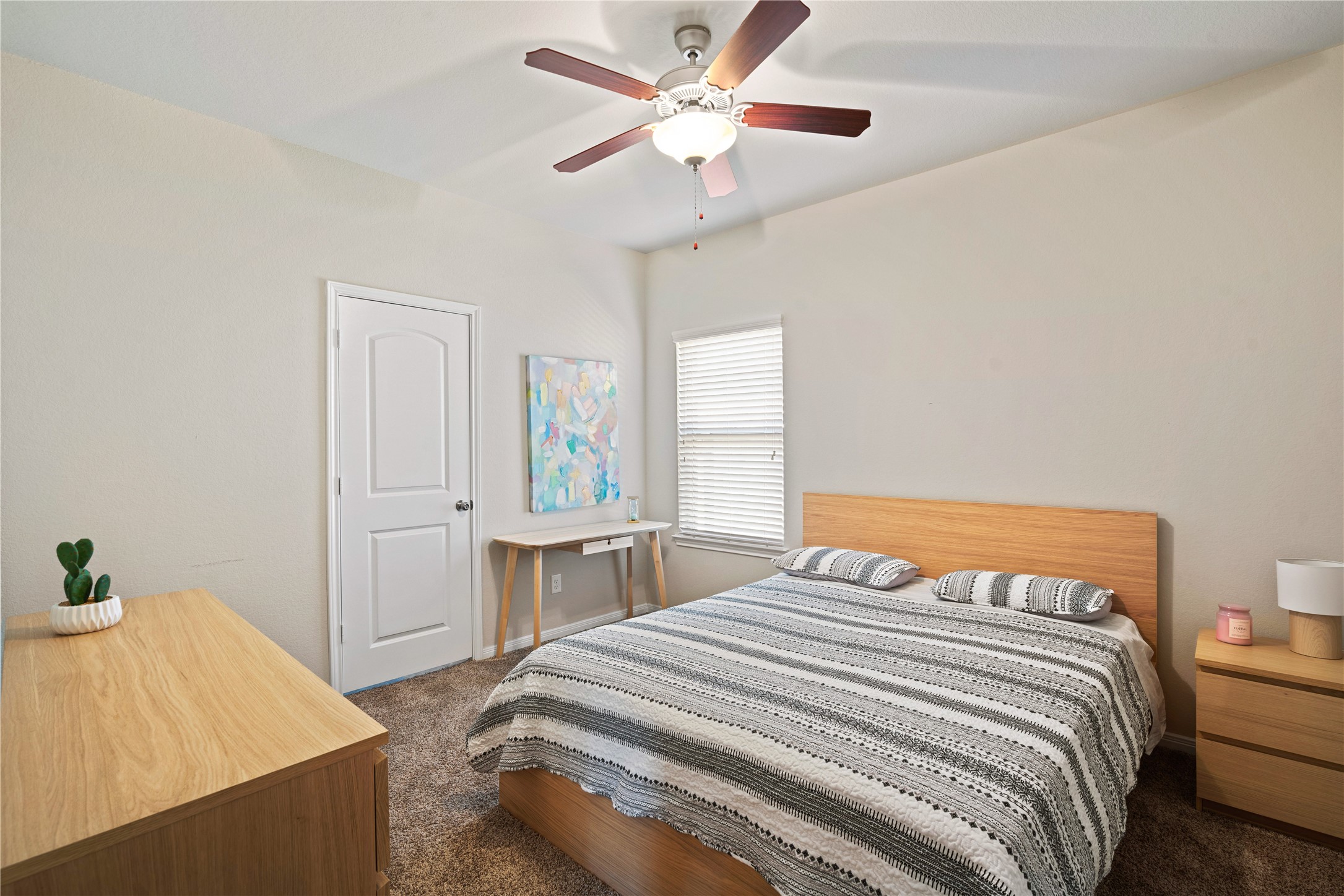 14300 Congaree Court Conroe, TX 77384 - Photo 24 of 31 a bedroom with a bed and a chandelier