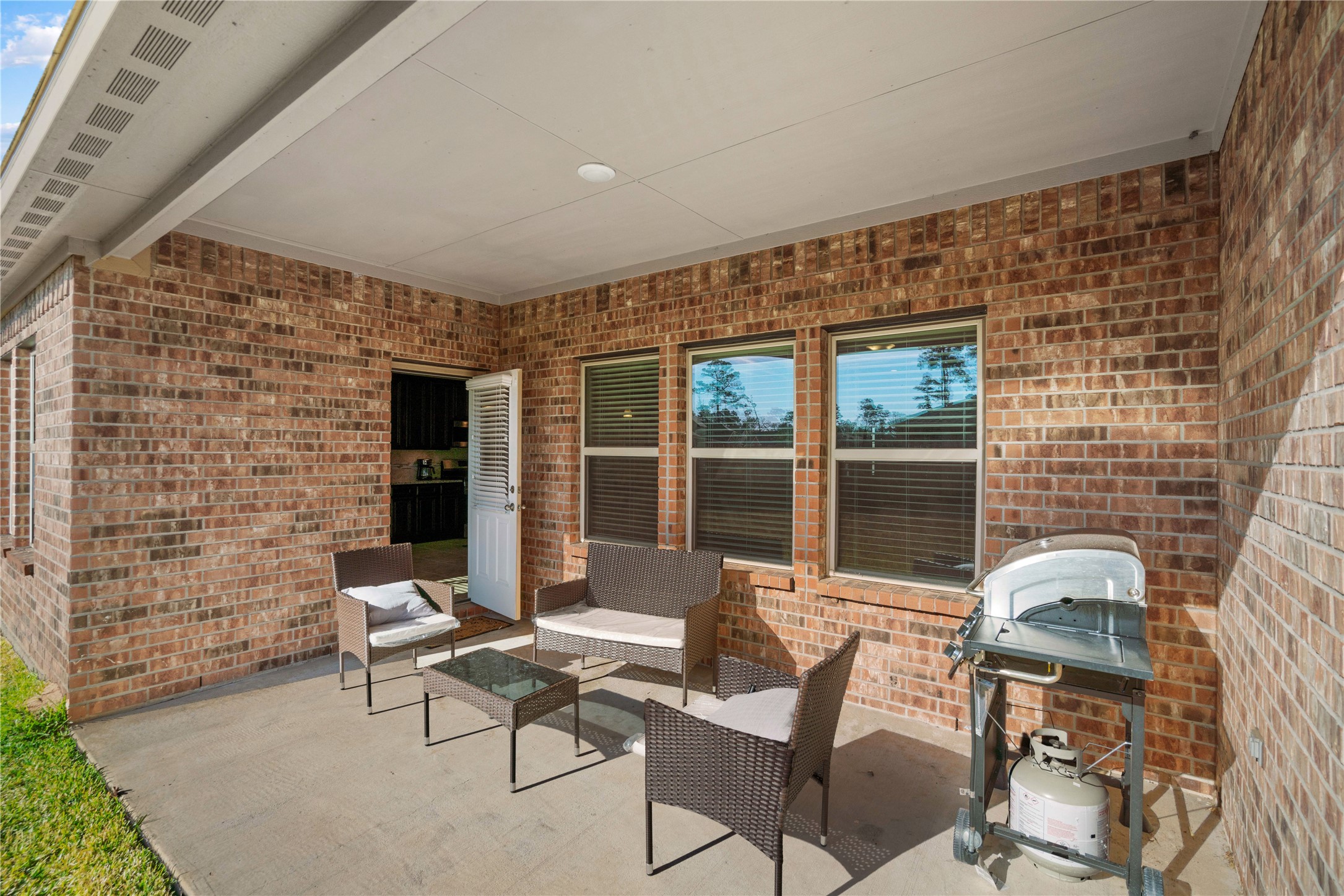 14300 Congaree Court Conroe, TX 77384 - Photo 26 of 31 a view of a patio with couple of chairs and a couch