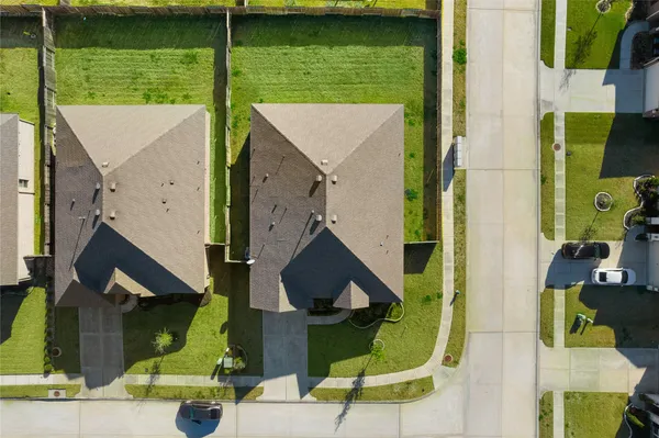 an aerial view of house with a swimming pool