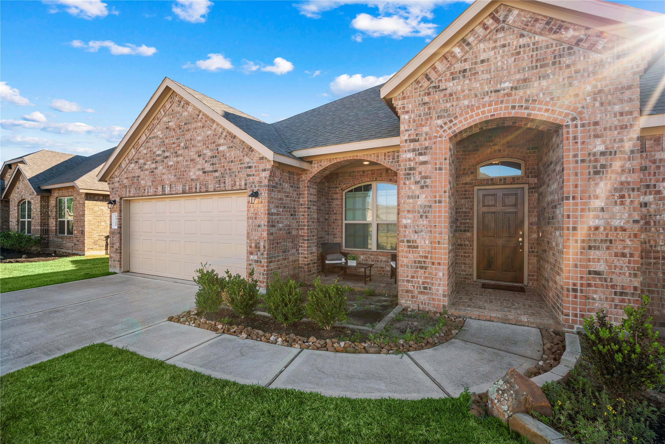 14300 Congaree Court Conroe, TX 77384 - Photo 5 of 31 a view of a house with brick walls and a yard with plants