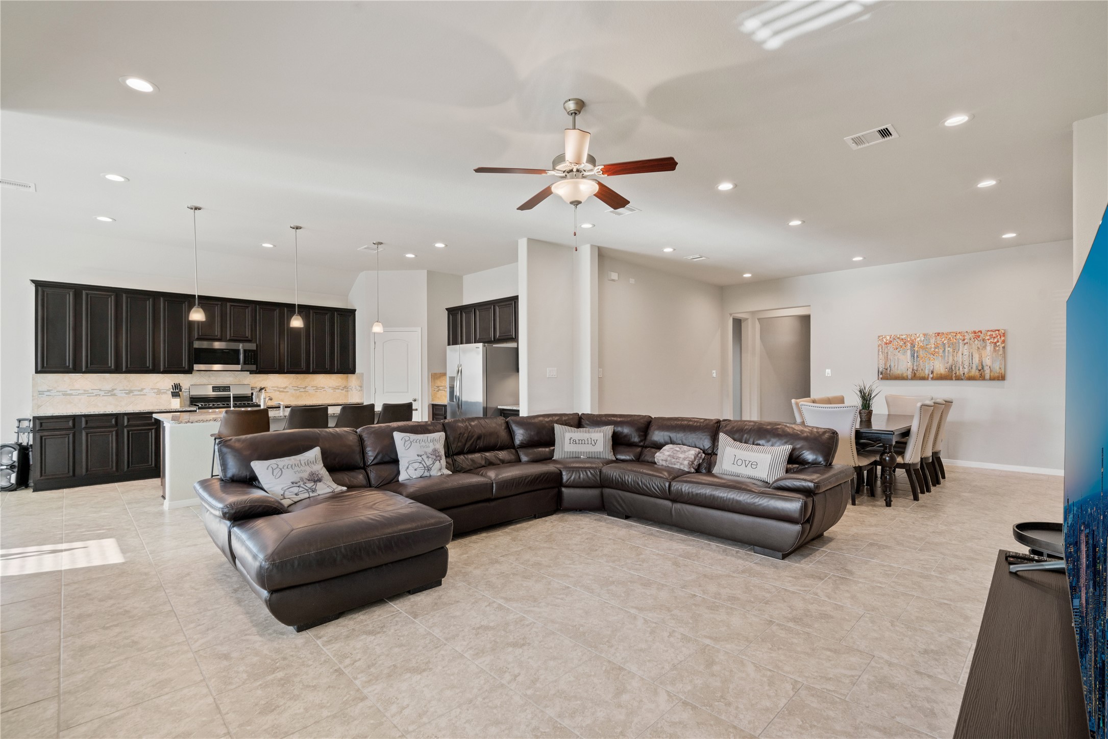 14300 Congaree Court Conroe, TX 77384 - Photo 8 of 31 a living room with furniture and a ceiling fan