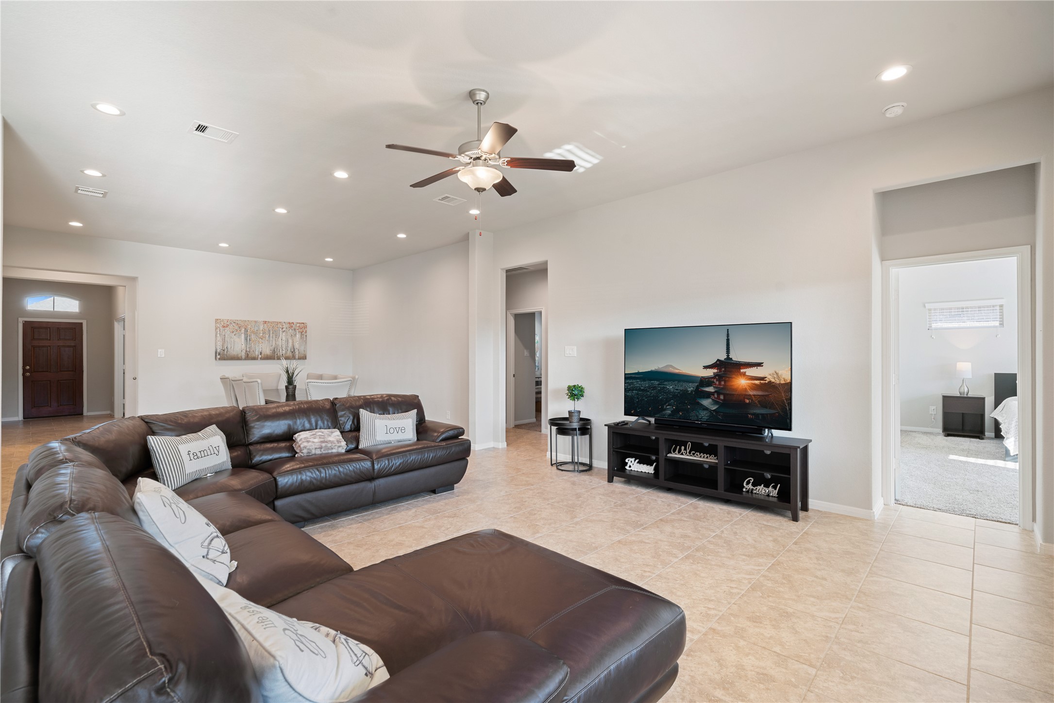 14300 Congaree Court Conroe, TX 77384 - Photo 9 of 31 a living room with furniture and a flat screen tv