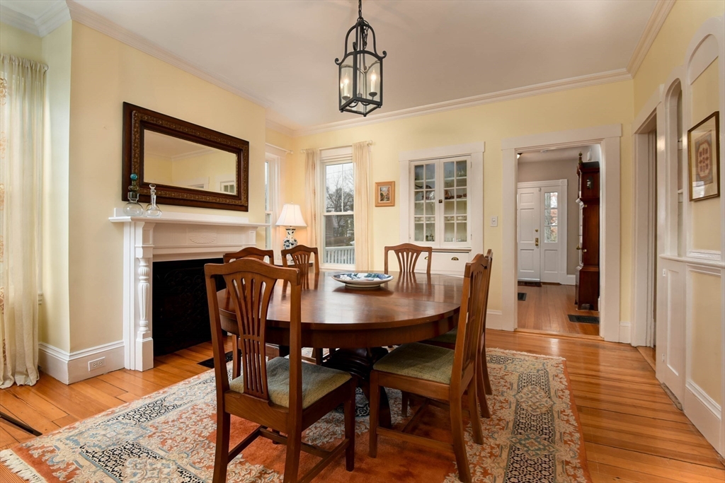 159 Warren Street Needham, MA 02492 - Photo 11 of 42 a view of a dining room with furniture window and wooden floor