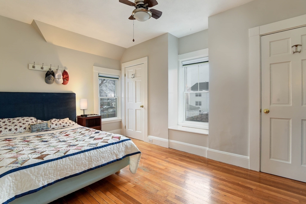 159 Warren Street Needham, MA 02492 - Photo 19 of 42 a bedroom with a large bed and a window
