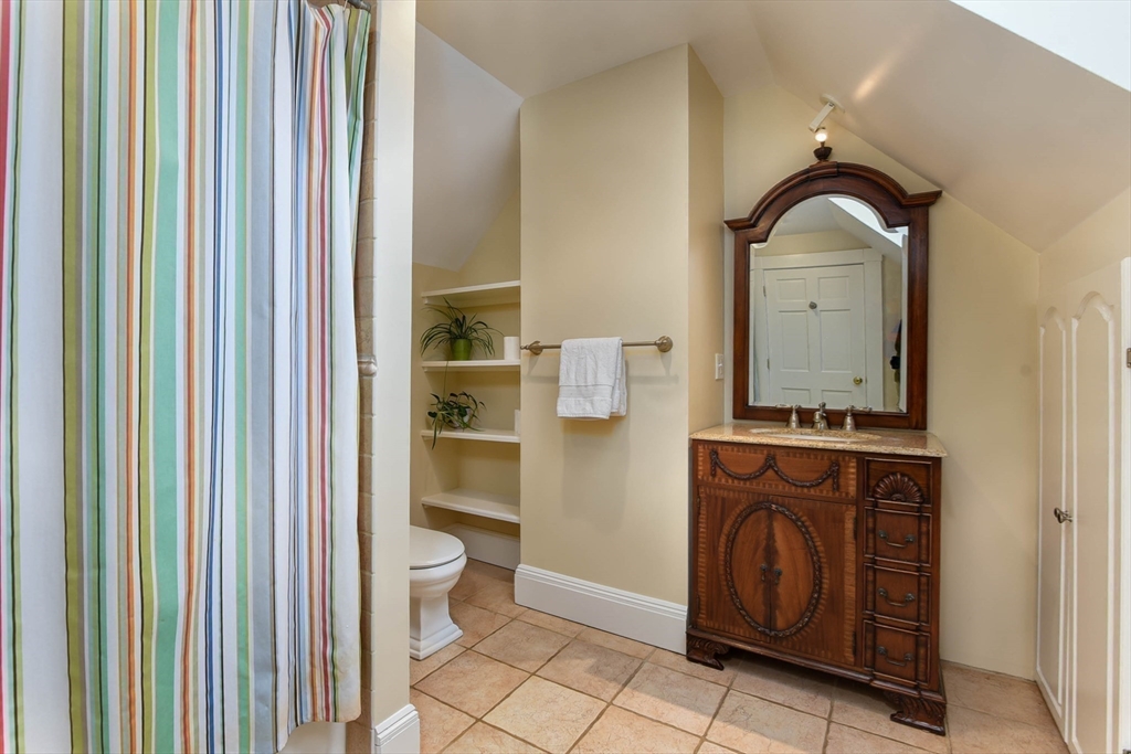 159 Warren Street Needham, MA 02492 - Photo 20 of 42 a view of a bathroom with washing machine and sink