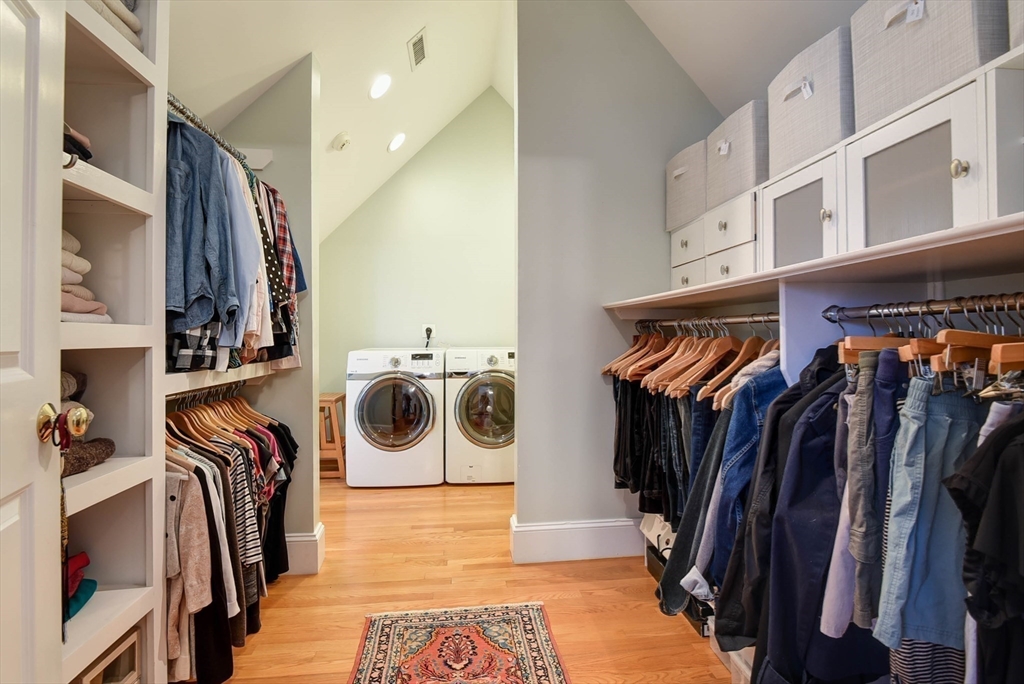 159 Warren Street Needham, MA 02492 - Photo 22 of 42 a view of walk in closet with clothes and shoes
