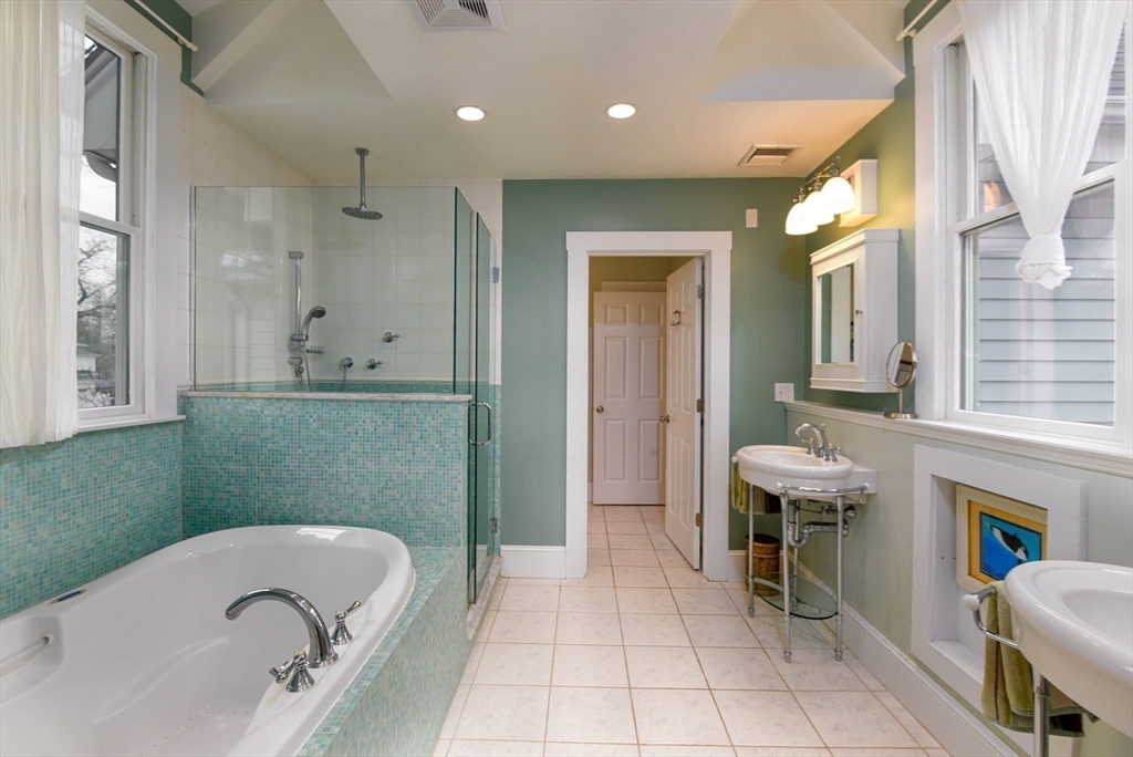 159 Warren Street Needham, MA 02492 - Photo 23 of 42 a bathroom with a sink a toilet and a bathtub