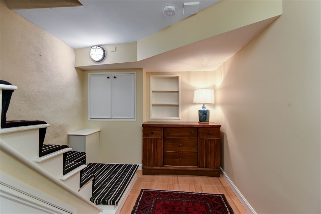159 Warren Street Needham, MA 02492 - Photo 25 of 42 a room with wooden floor and window