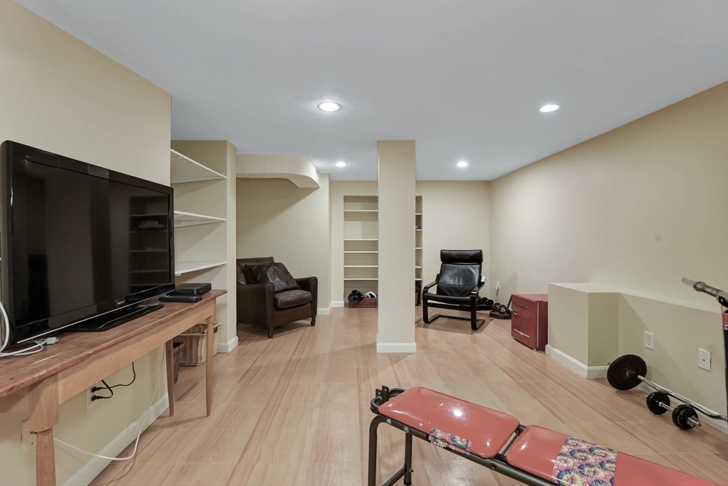 159 Warren Street Needham, MA 02492 - Photo 26 of 42 a living room with furniture and a flat screen tv
