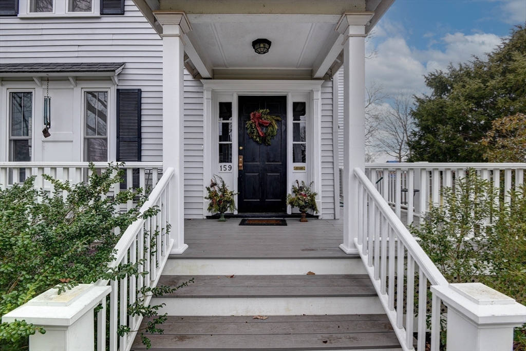 159 Warren Street Needham, MA 02492 - Photo 27 of 42 a front view of a house with a yard